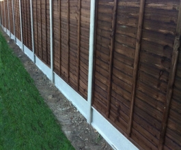 Concrete slotted posts with brown lap panels Thumbnail